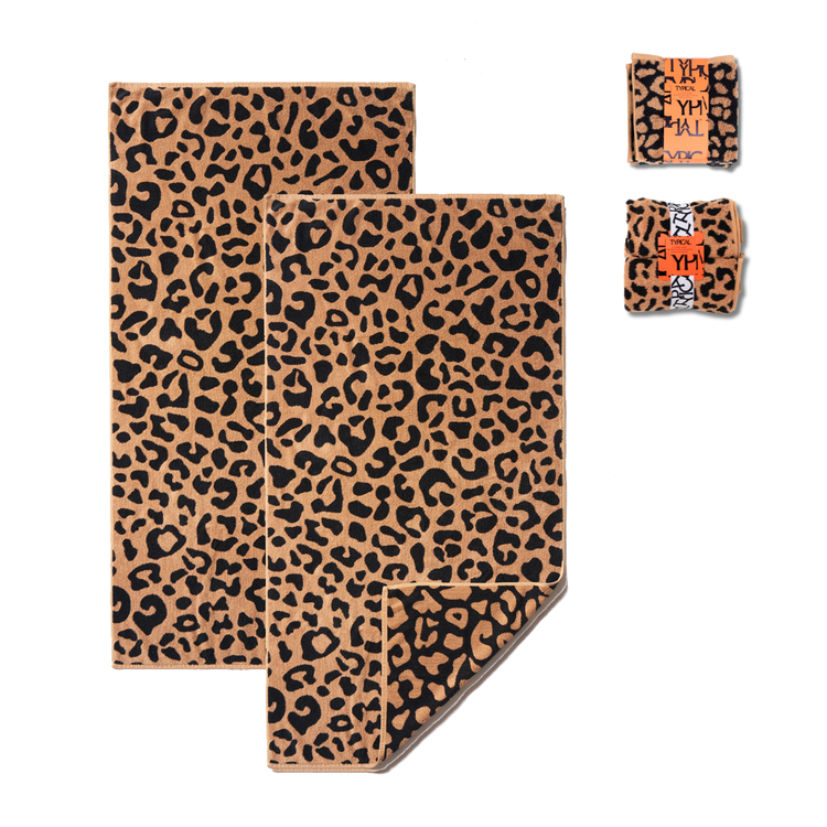 Leopard print towel set with packaging on a white background