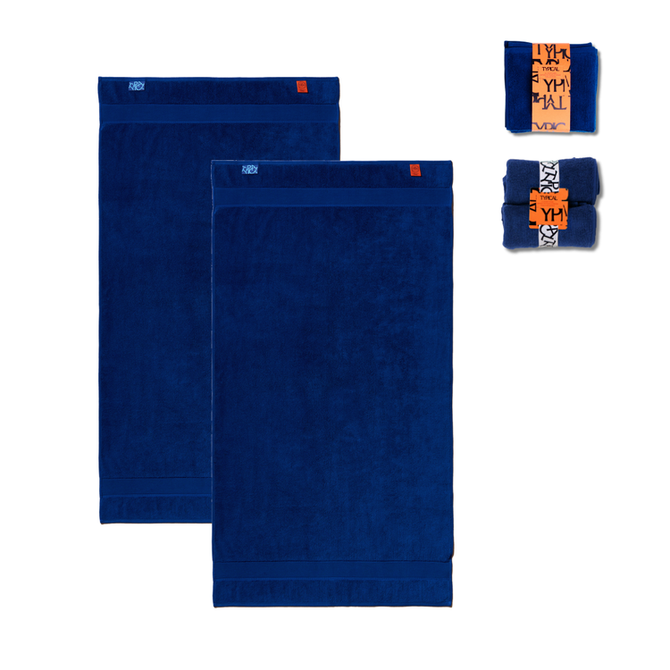 Set of blue towels with orange labels on a white background