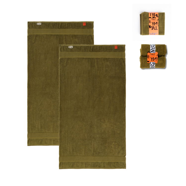Two olive green towels with a brand label on a white background