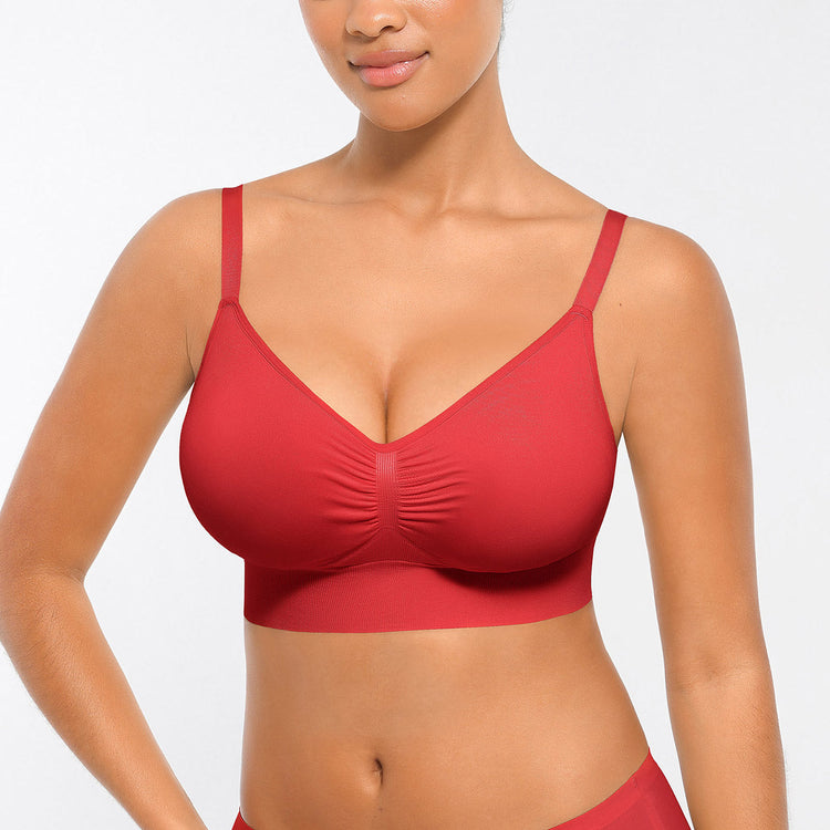 Red bikini top worn by a model on a plain background