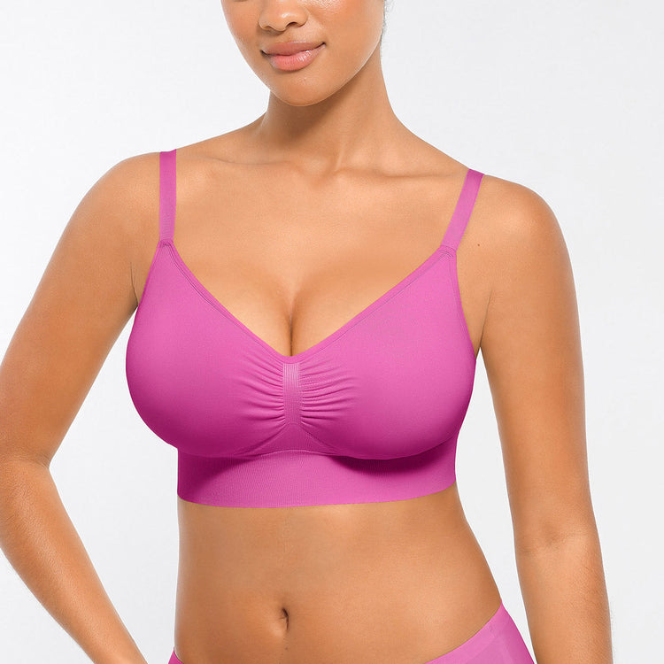 Woman wearing a pink bikini top against a white background