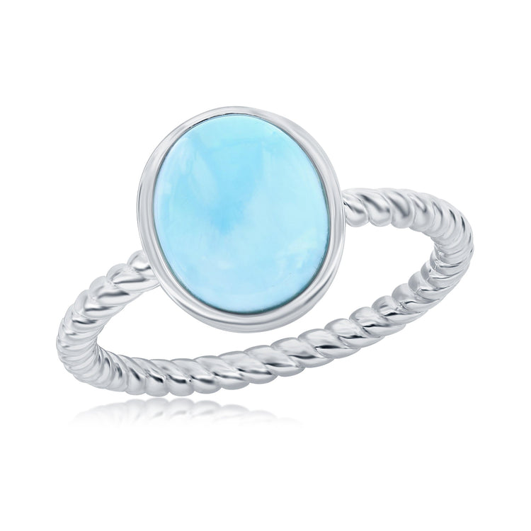 Silver ring with a blue stone on a white background