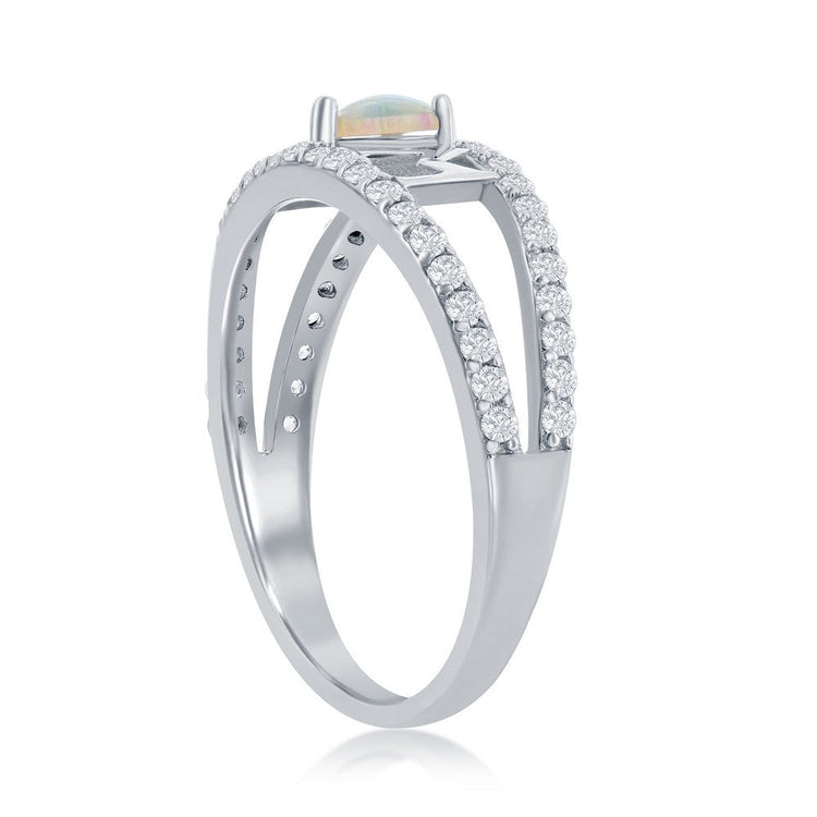 Silver ring with gemstone and diamonds on a white background