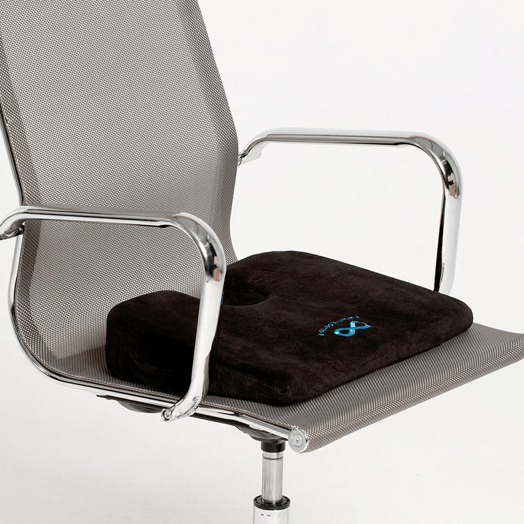 Black cushion with a logo on an office chair