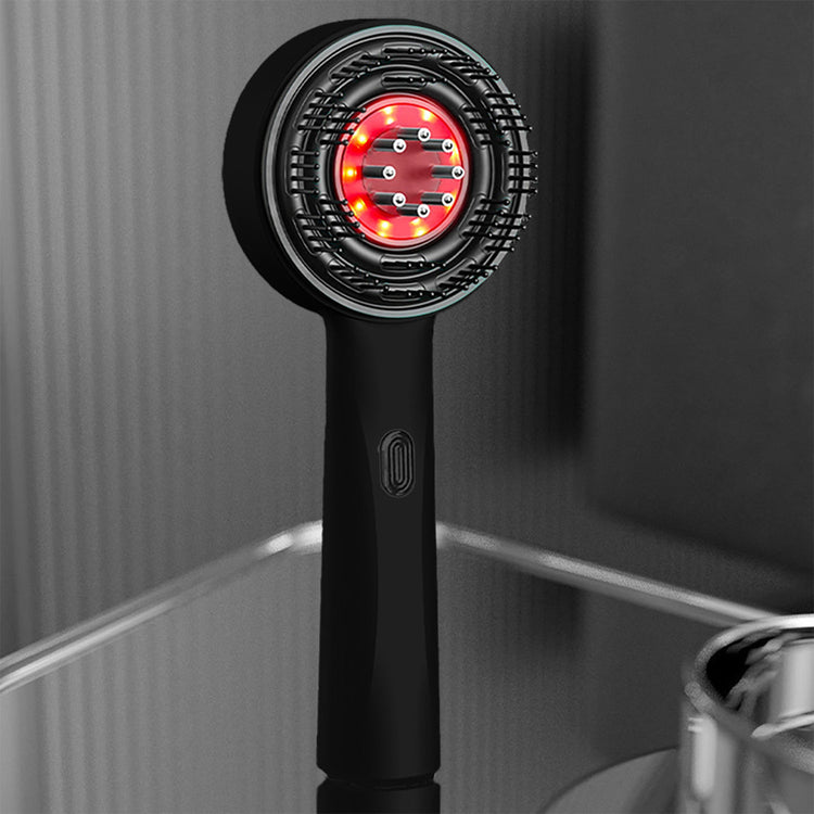 Black handheld hair dryer with red light on a gray background