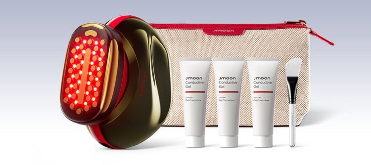 Beauty device with skincare products and accessories on a light gray background