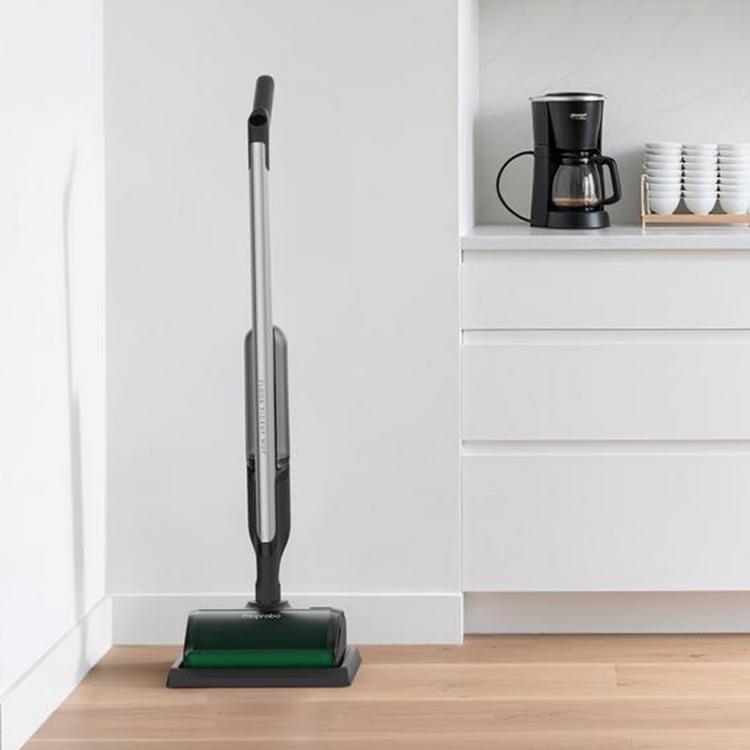 Vacuum cleaner on a wooden floor in a kitchen setting