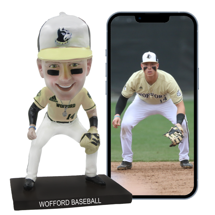 Wofford baseball bobblehead and smartphone displaying a player on a field
