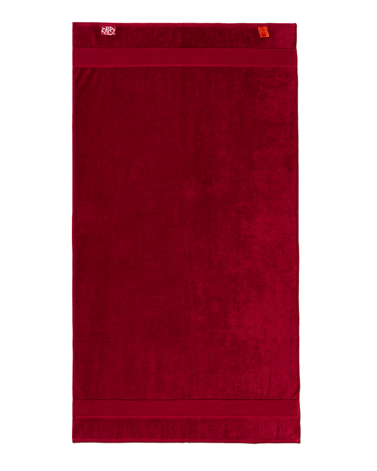 Red towel with a brand logo on a white background