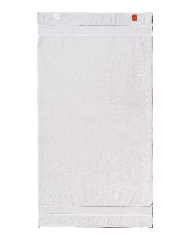 White towel with a red label on a black background