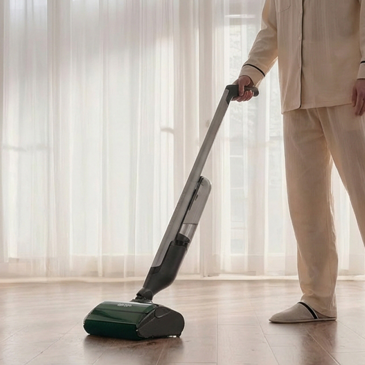 Person using a vacuum cleaner on a wooden floor with sheer curtains in the background
