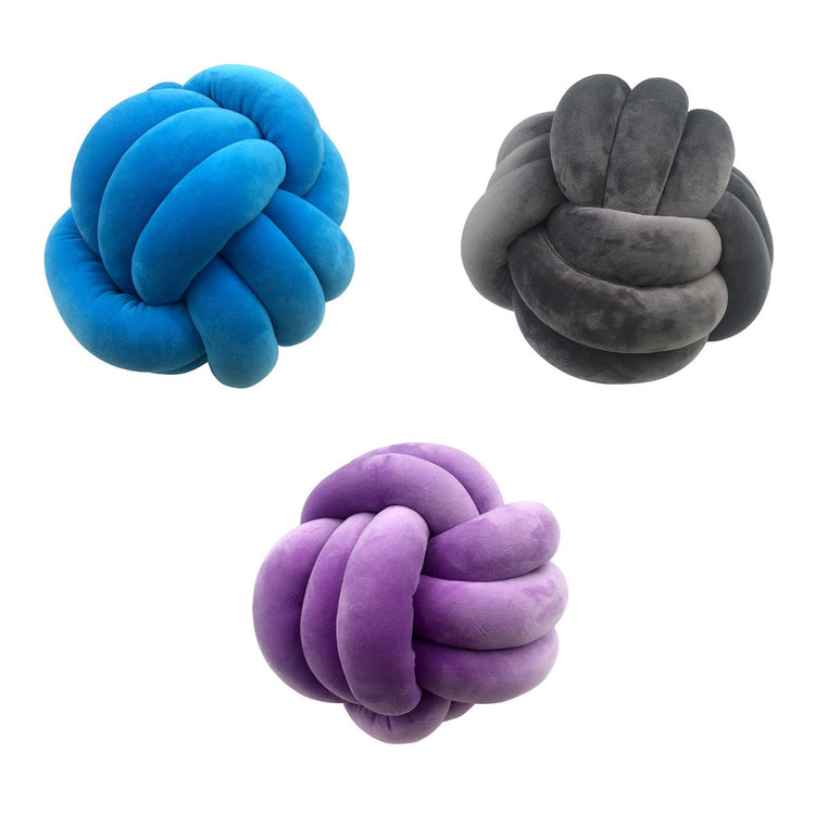 Three knot-shaped toys in blue, gray, and purple on a white background