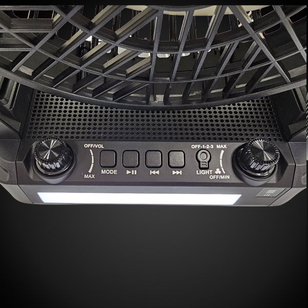 Control panel of a black device with knobs and buttons on a dark background