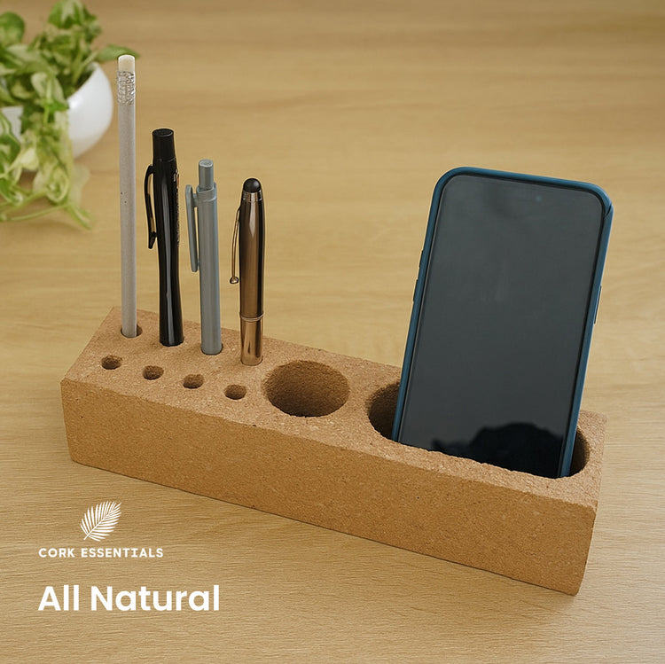 Cork desk organizer with phone and pens on a wooden surface, featuring the Cork Essentials brand.