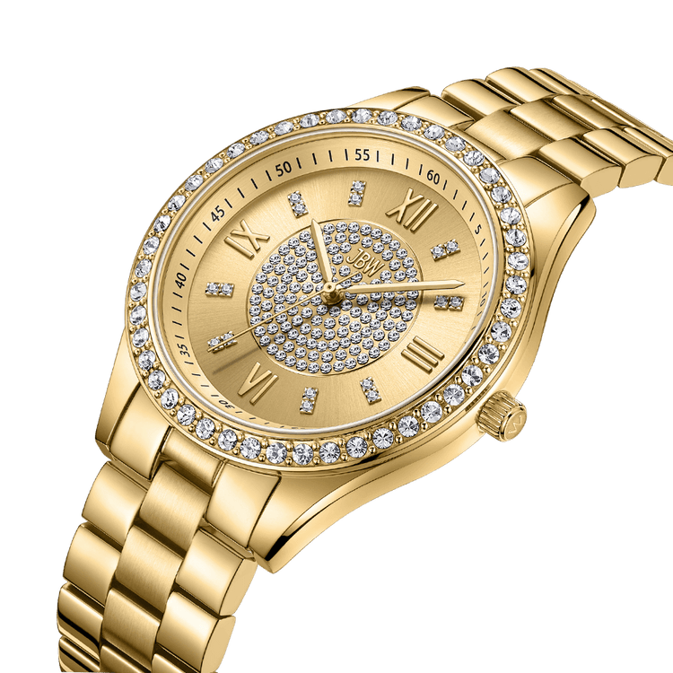 The JBW Mondrian | J6303B is an elegant 18K gold-plated watch featuring a metal link band, round face, Roman numerals, clear crystals on the bezel and dial, and gold hands—a luxurious everyday timepiece.