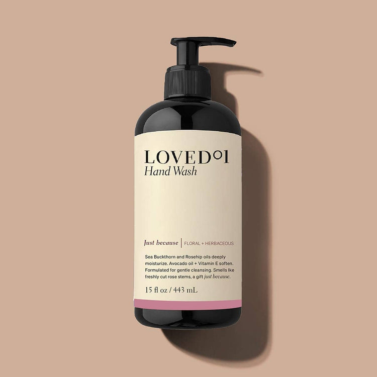 Loved 1 Hand Wash bottle on a beige background