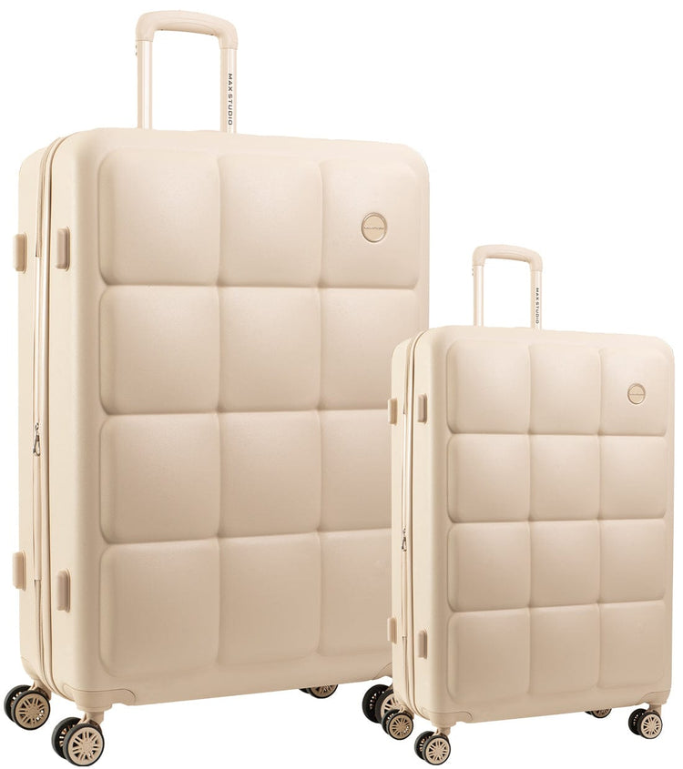 Two beige suitcases of different sizes on a white background