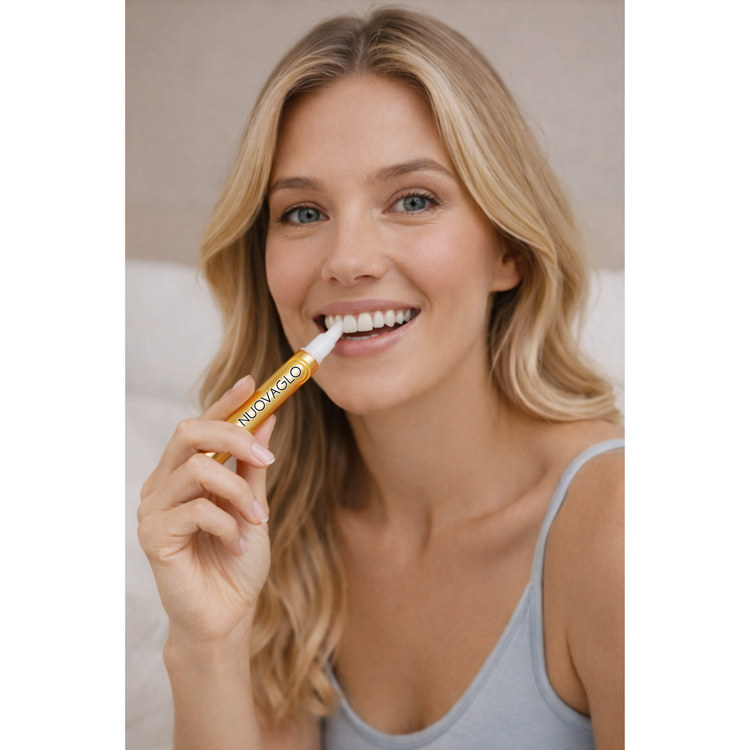 Woman applying a cosmetic product to her lips with a applicator.