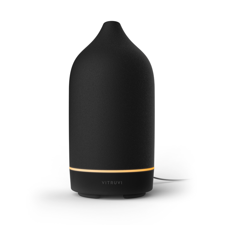 Black Vitruvi diffuser on a white background