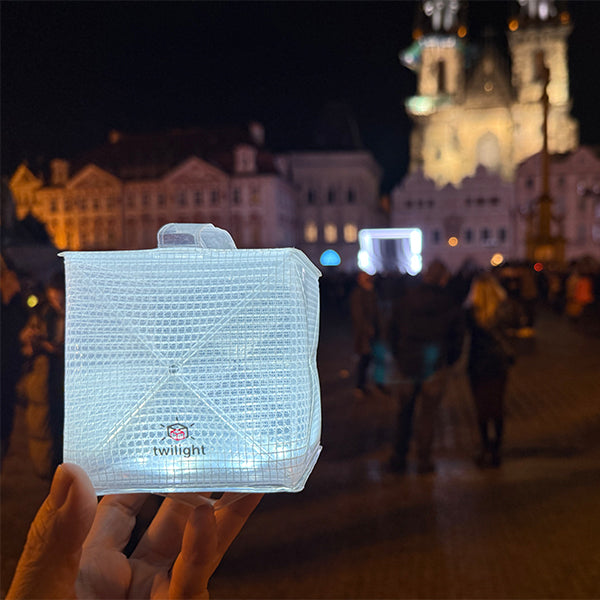 Petite white solar lantern for traveling in the city.
