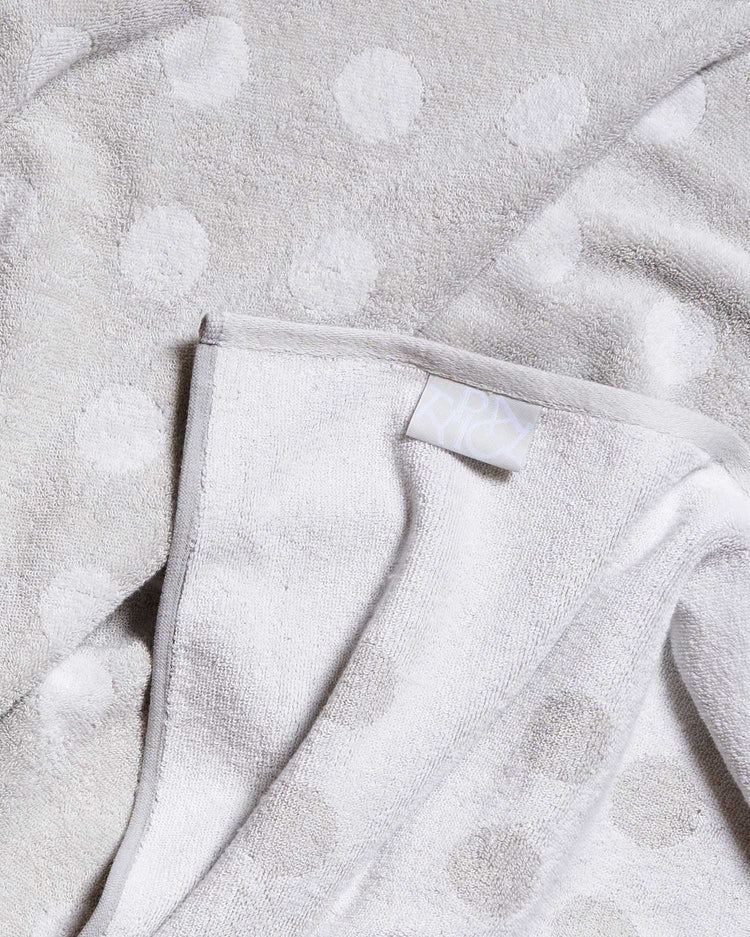 Close-up of a textured gray fabric with a subtle pattern