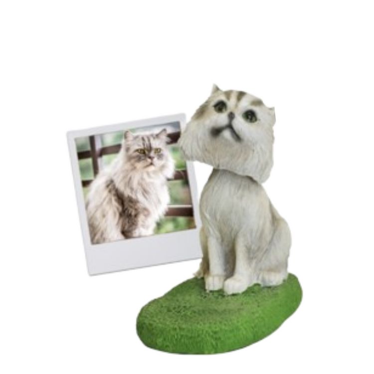 Cat figurine with a photo of a cat on a white background