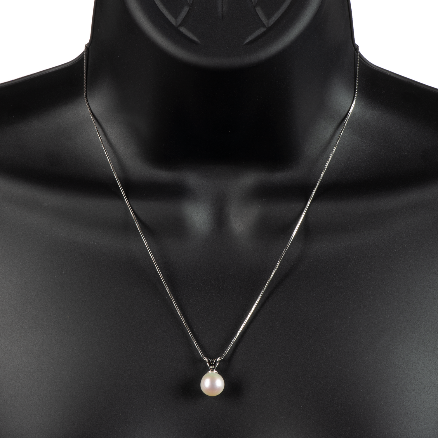 An image of a single white freshwater cultured pearl on a .925 sterling silver setting and chain on a black mannequin