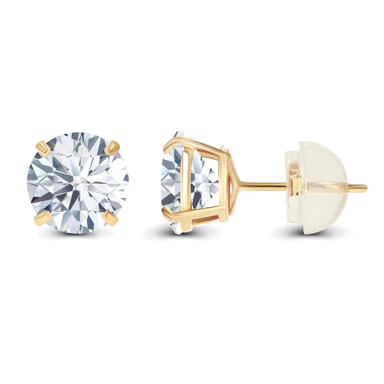 Gold stud earrings with clear gemstones on a white background