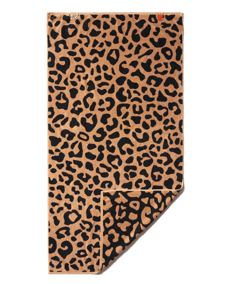 Leopard print towel on a black background