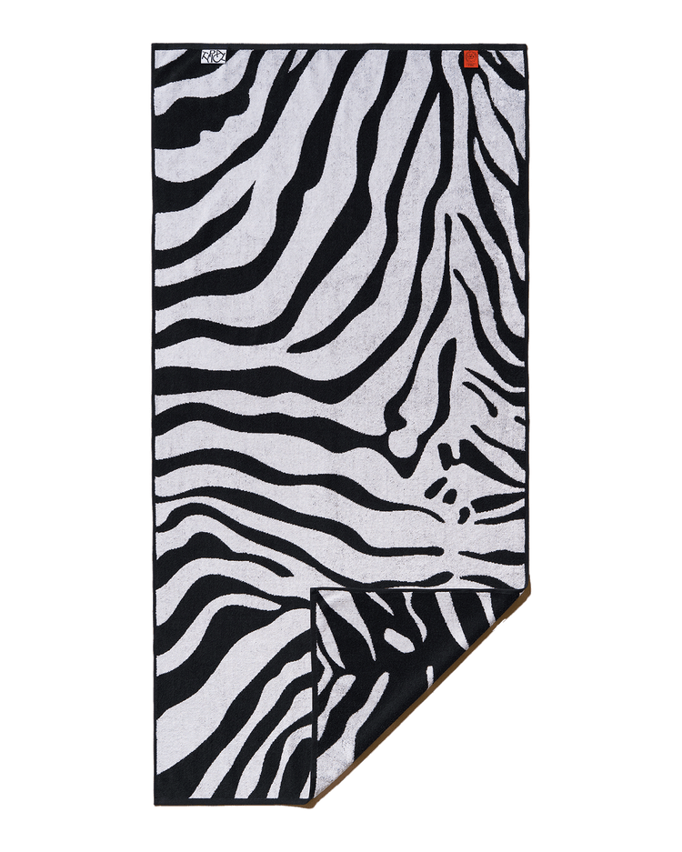 Zebra patterned towel on a black background