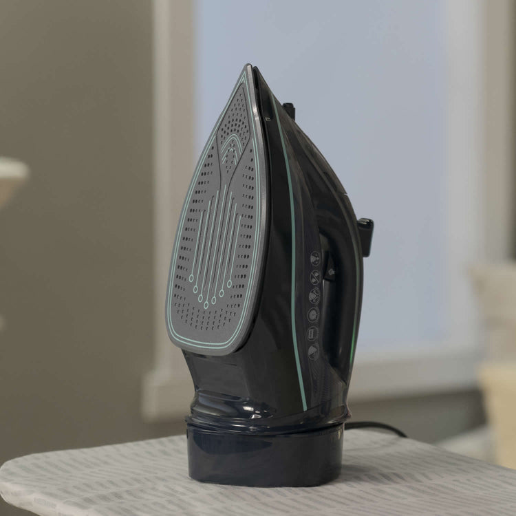 Black iron on a table with a blurred background