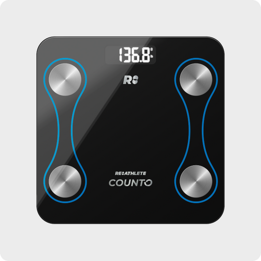 A black digital smart scale with blue decorative elements and silver brand logos, displaying a weight reading.
