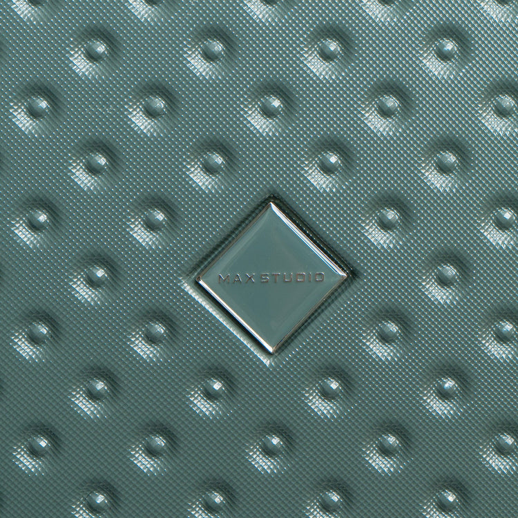 Textured green surface with MAXSTUDIO logo