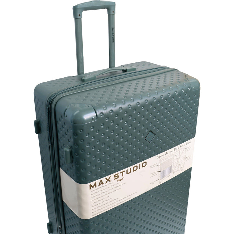 Green textured suitcase with 'Max Studio' branding on a white background