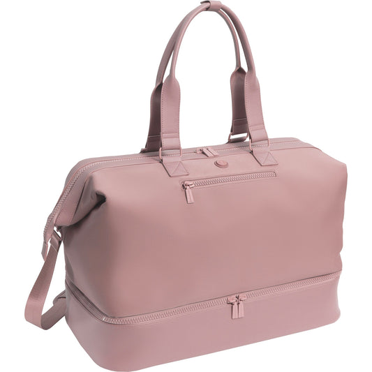Pink duffel bag with handles and a shoulder strap on a white background