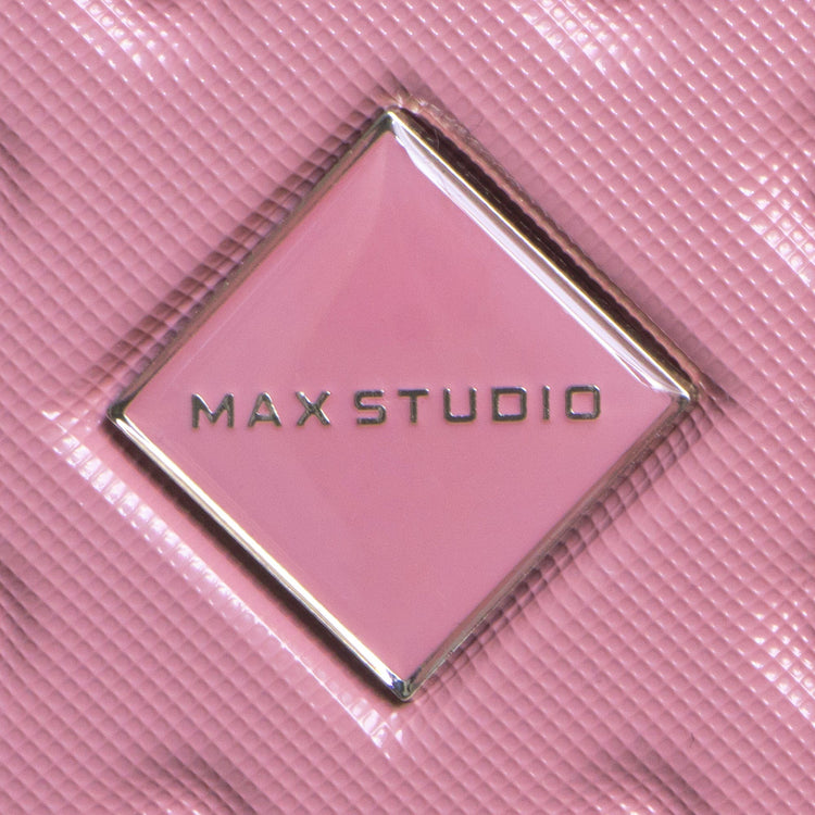 Close-up of a pink product with 'MAX STUDIO' logo on a pink background
