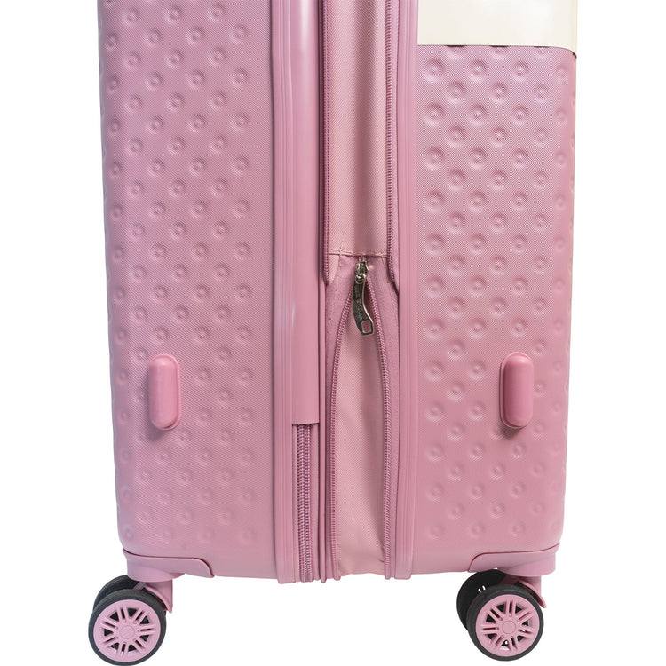 Pink textured suitcase with wheels on a white background