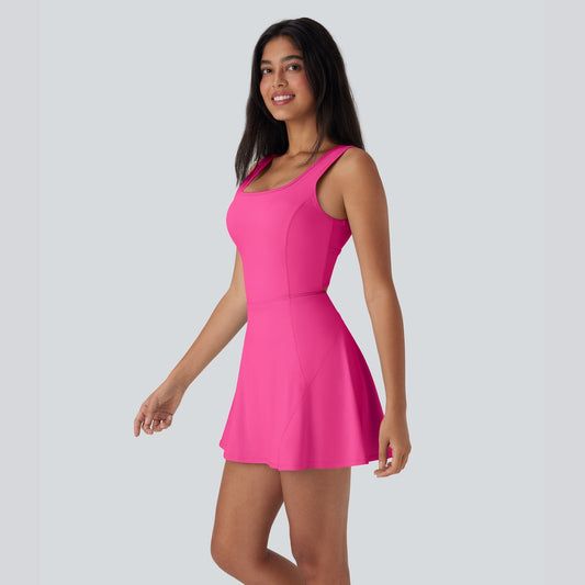 Woman wearing a bright pink dress on a gray background