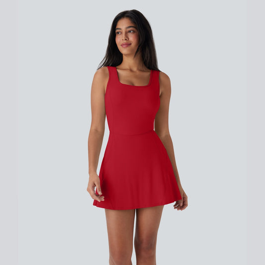 Woman wearing a red dress against a plain background