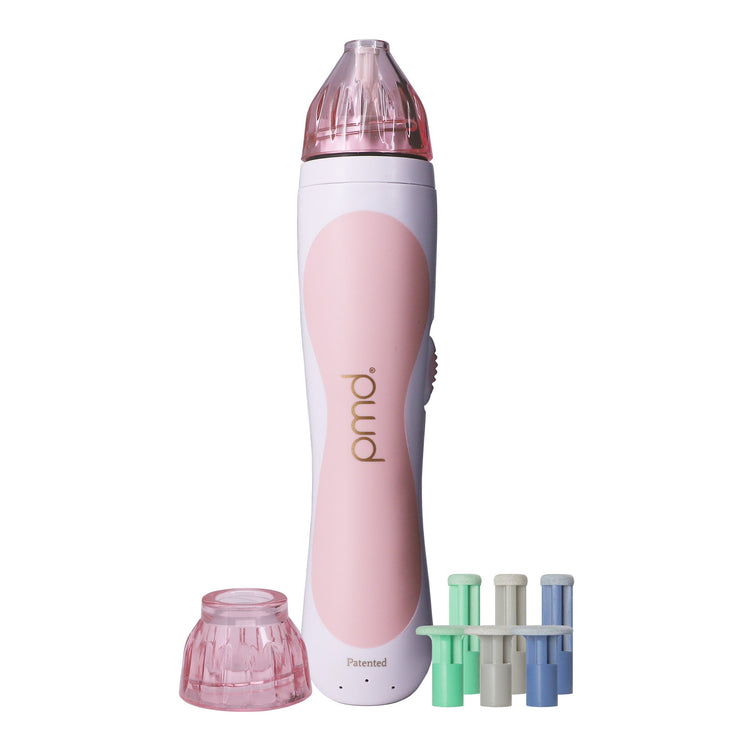 Pink and white pmu device with attachments on a white background