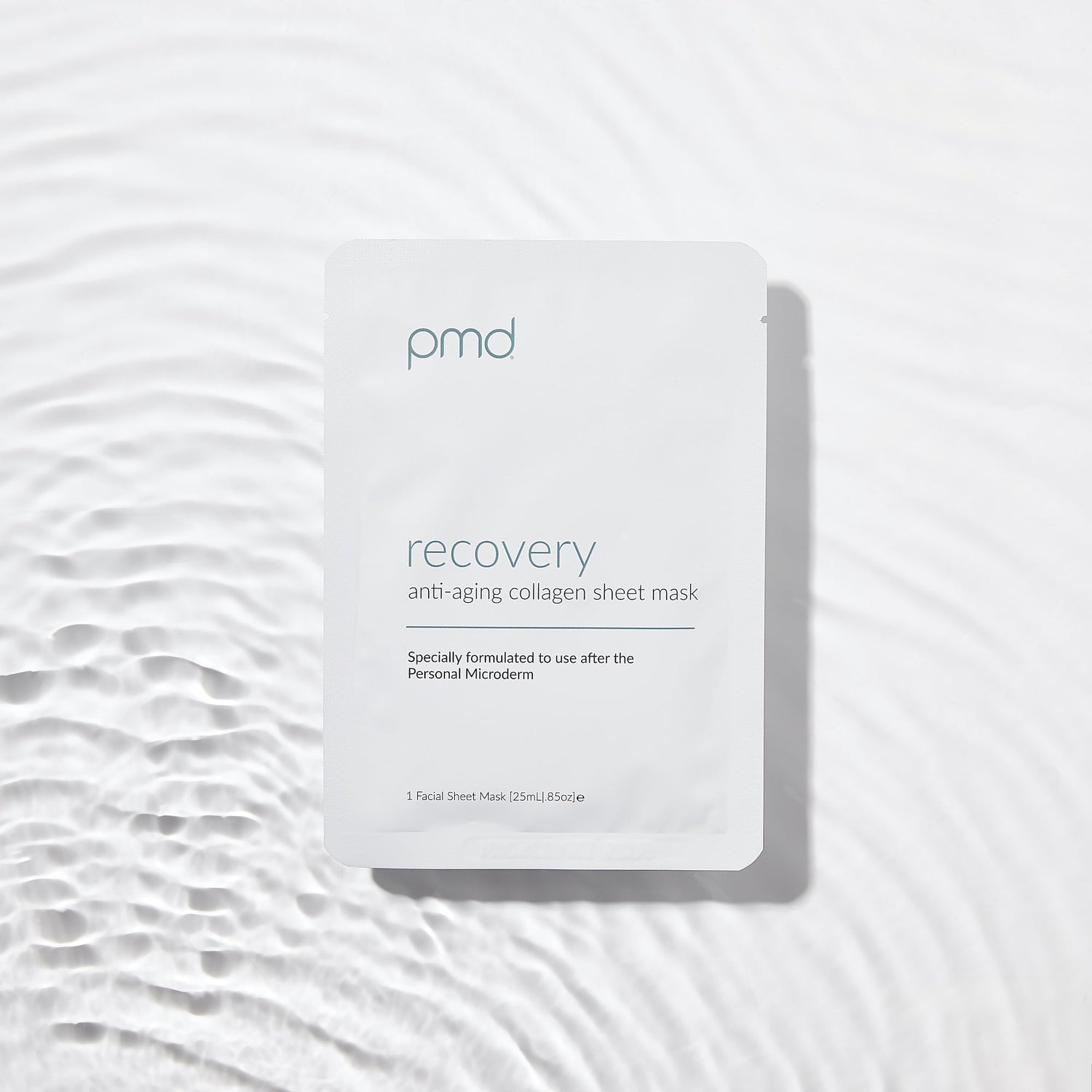 PMD recovery anti-aging collagen sheet mask packaging on a textured white background