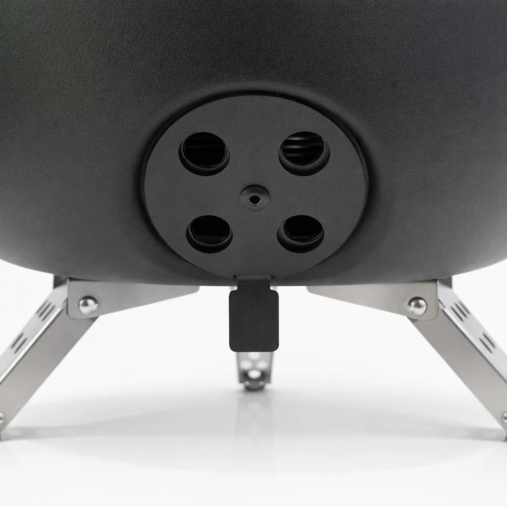 Close-up of a black outdoor fire pit with metal legs on a white background
