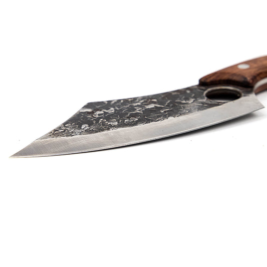 Behold the elegance of the Hakai Cleaver Knife from Seido Knives, with its wooden handle, poised on a cutting board. 