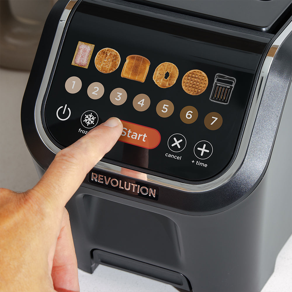 Hand pressing a button on a kitchen appliance with digital display and 'Revolution' branding.
