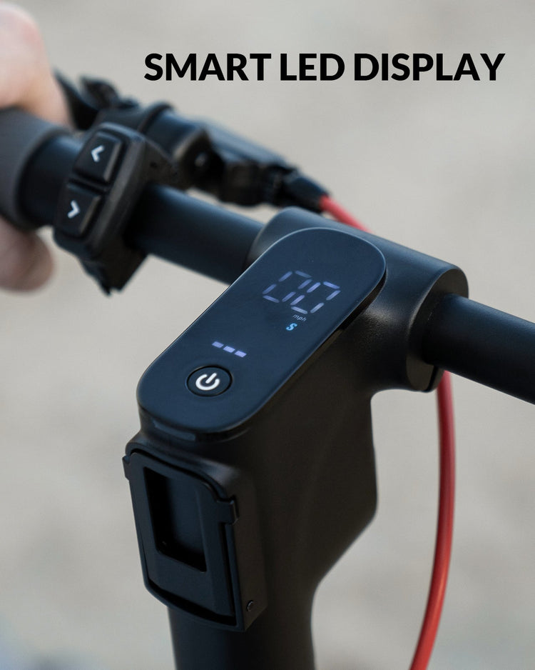 Smart LED display on a scooter handlebar with a blurred background