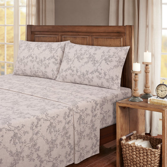 Stack of floral-patterned sheets on a white background