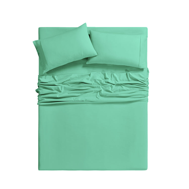 Mint green bedding set with fitted sheet and pillowcases on a white background
