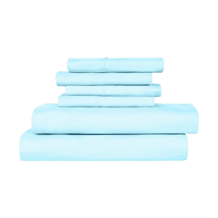 Set of light blue bed sheets stacked on a white background