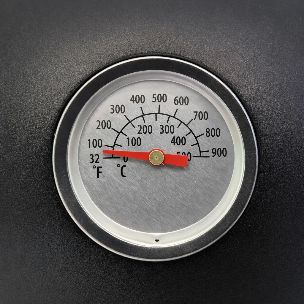 Temperature gauge with red needle on a black background