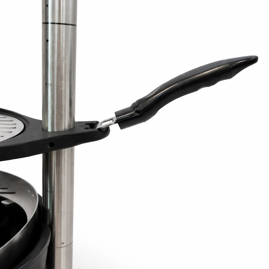 Close-up of a black frying pan with a handle on a white background
